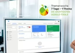 Zwei Mitarbeiter vor dem großen Screen